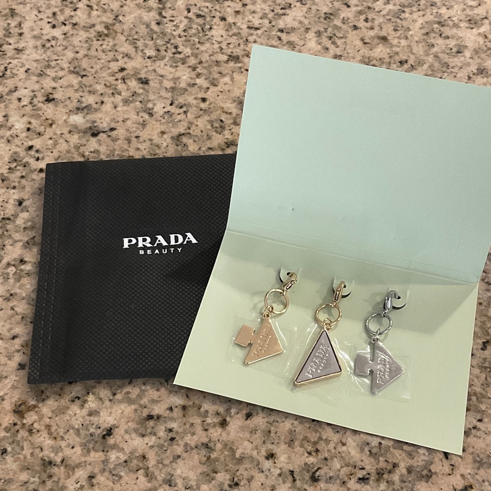 Prada Triangle Logo Charm Earrings — Gold & Silver